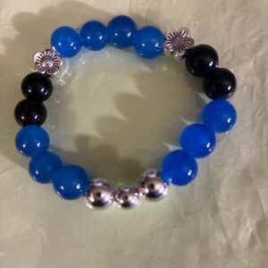 Chic Blue and Black Beaded Bracelet with Silver Floral Details